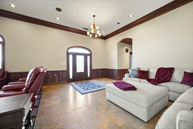 living room featuring visible vents, a chandelier, a wainscoted wall, recessed lighting, and arched walkways