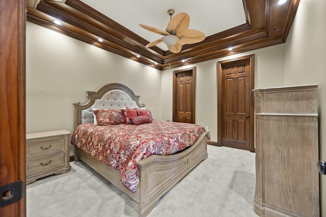 bedroom featuring light carpet, baseboards, ceiling fan, and ornamental molding