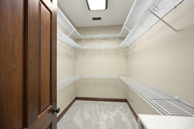 walk in closet with carpet and visible vents