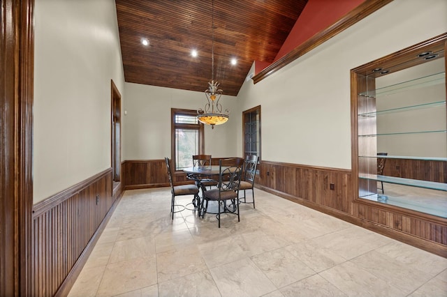 dining space featuring a wainscoted wall, recessed lighting, wooden ceiling, wood walls, and lofted ceiling