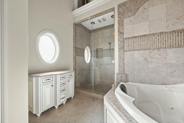 full bathroom with tile patterned floors, a tub with jets, a shower stall, and visible vents