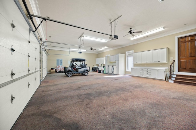 garage with a garage door opener and a ceiling fan