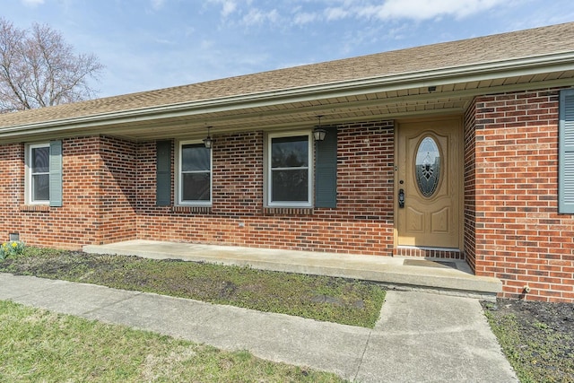 entrance to property with brick siding