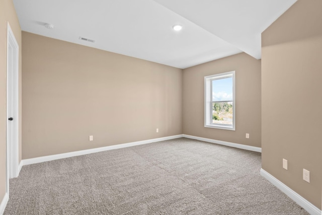 carpeted spare room with recessed lighting, visible vents, and baseboards