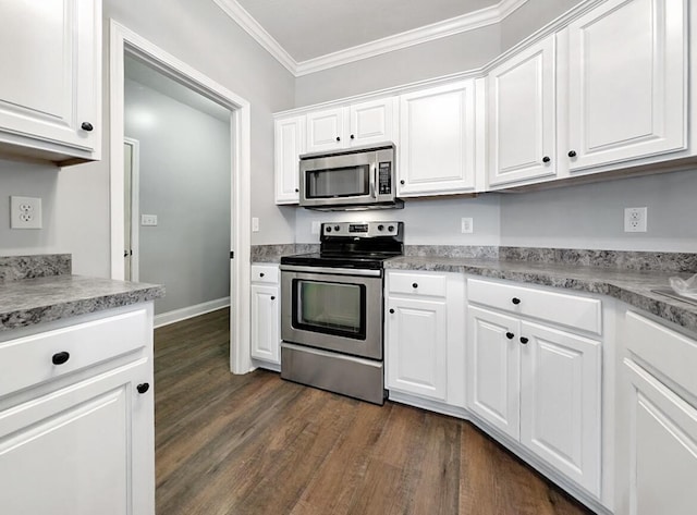 kitchen with dark wood finished floors, white cabinetry, stainless steel appliances, and crown molding