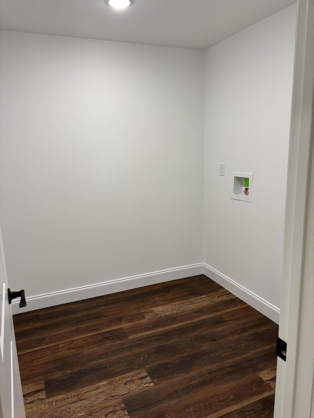 laundry area with baseboards, dark wood-type flooring, hookup for a washing machine, and laundry area