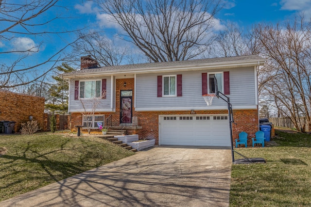 split foyer home with brick siding, a front lawn, a chimney, driveway, and an attached garage