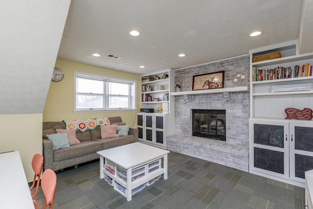 living room with built in features, visible vents, recessed lighting, a brick fireplace, and dark colored carpet