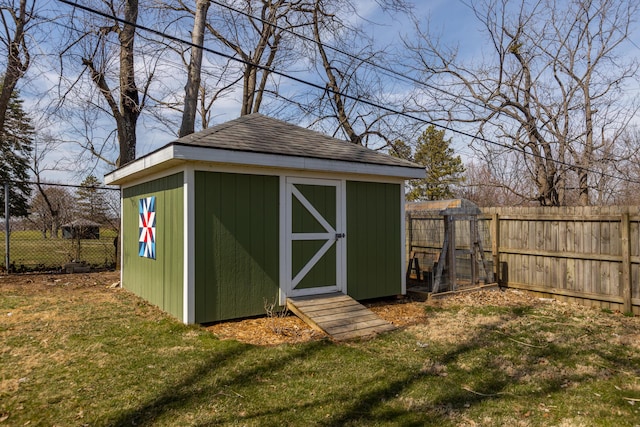 view of shed with a fenced backyard