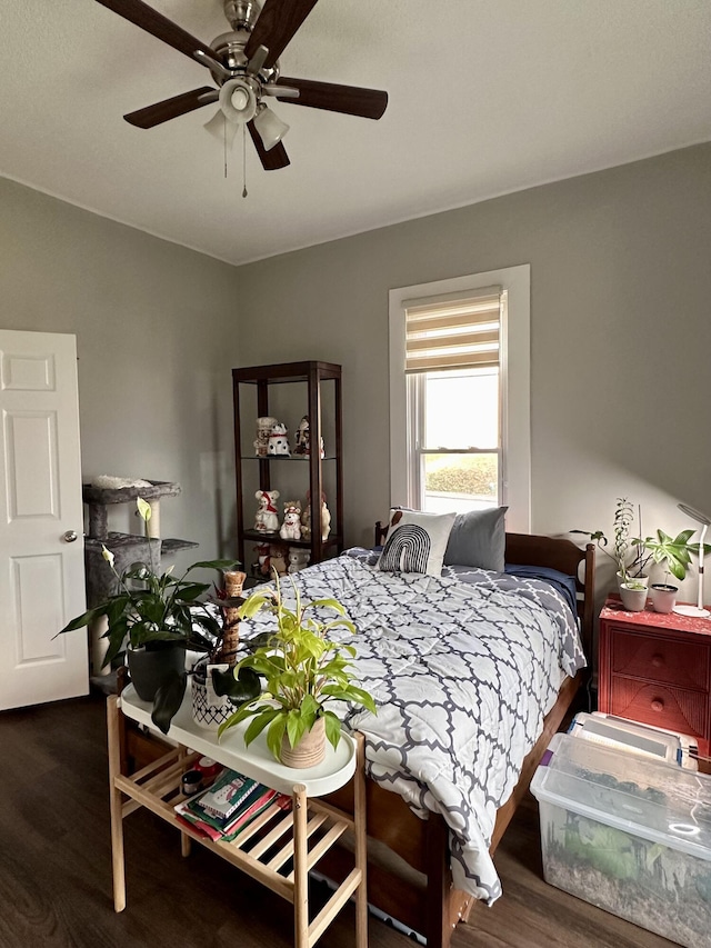 bedroom featuring ceiling fan and wood finished floors