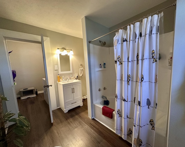 full bath with vanity, shower / bath combination with curtain, heating unit, and wood finished floors