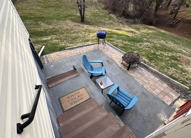 view of patio / terrace featuring an outdoor fire pit