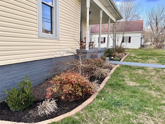 view of yard featuring covered porch