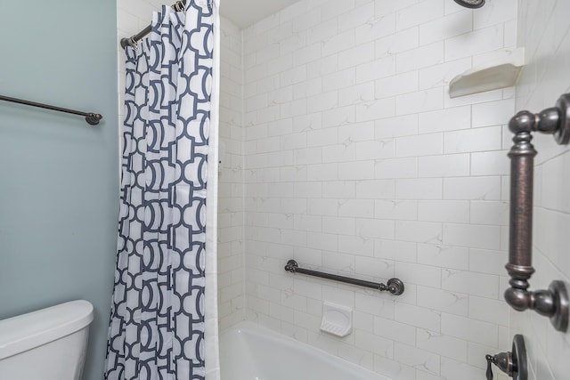 full bath featuring toilet and shower / bath combo with shower curtain