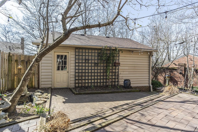 view of outbuilding with fence