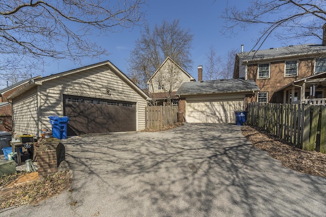 exterior space with a chimney and fence