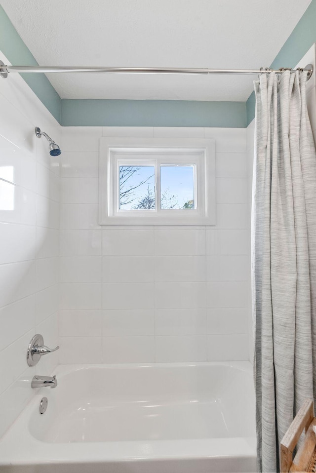 bathroom featuring shower / bath combo with shower curtain