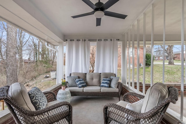 sunroom featuring a ceiling fan