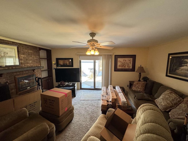 living room with carpet flooring, a fireplace, and ceiling fan