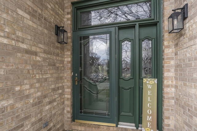 entrance to property with brick siding