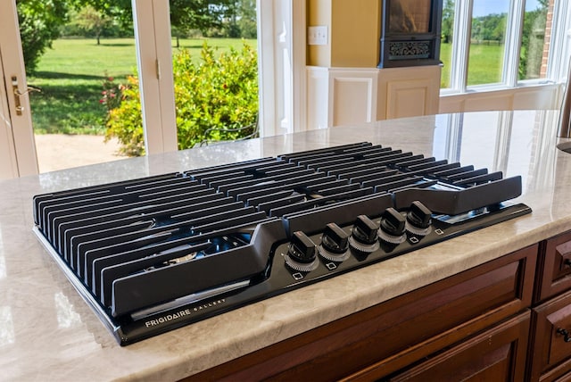 interior details featuring light countertops and stovetop