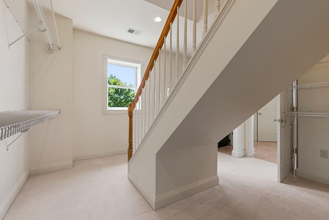 interior space with recessed lighting, visible vents, carpet floors, and baseboards