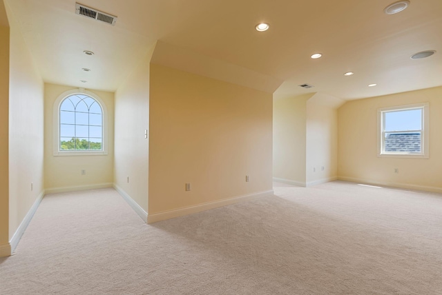 unfurnished room with baseboards, recessed lighting, visible vents, and light carpet