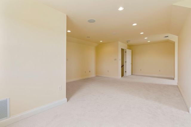 unfurnished room featuring recessed lighting, visible vents, baseboards, and light colored carpet