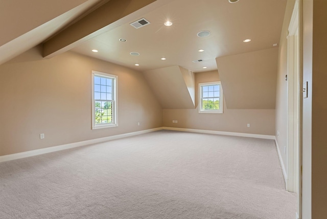 additional living space featuring visible vents, recessed lighting, carpet, baseboards, and vaulted ceiling with beams