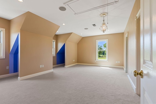 additional living space featuring carpet flooring, recessed lighting, attic access, and baseboards