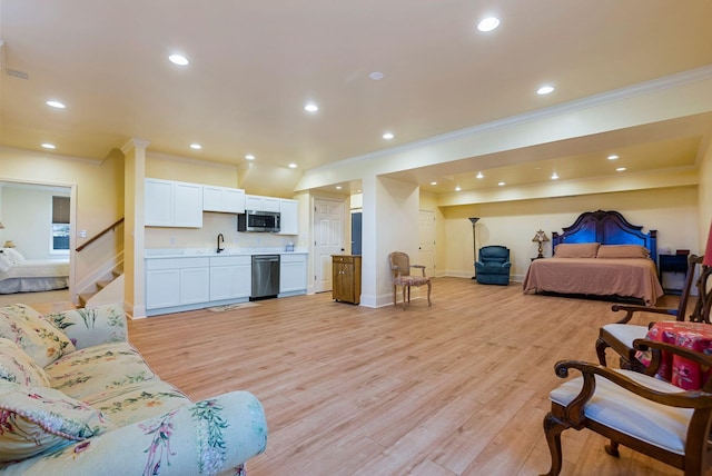 bedroom with recessed lighting, baseboards, light wood-style floors, and ornamental molding