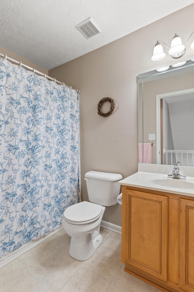 full bathroom with visible vents, toilet, a textured ceiling, tile patterned flooring, and vanity