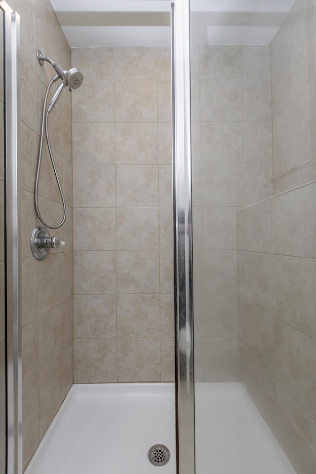 full bathroom with a shower stall