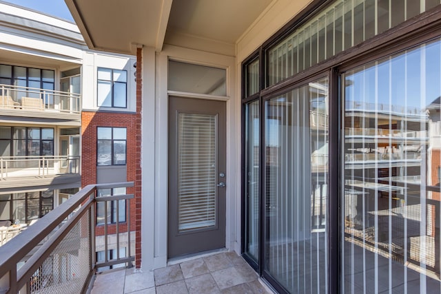 entrance to property featuring a balcony