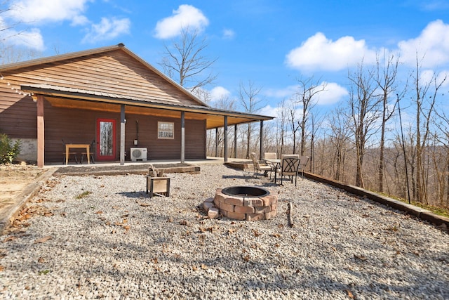 exterior space featuring an outdoor fire pit