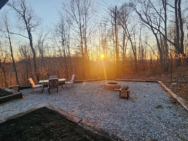 view of yard with a fire pit and a patio area