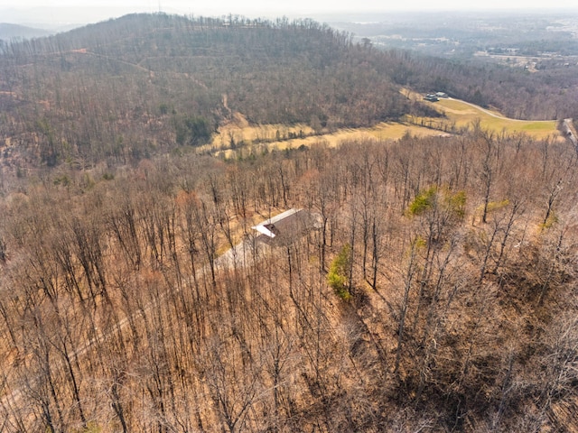 birds eye view of property with a wooded view