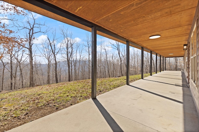 view of patio with a wooded view