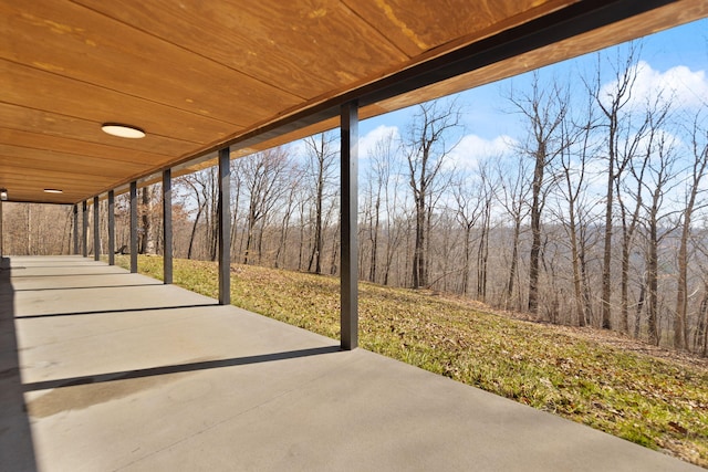 view of patio featuring a forest view