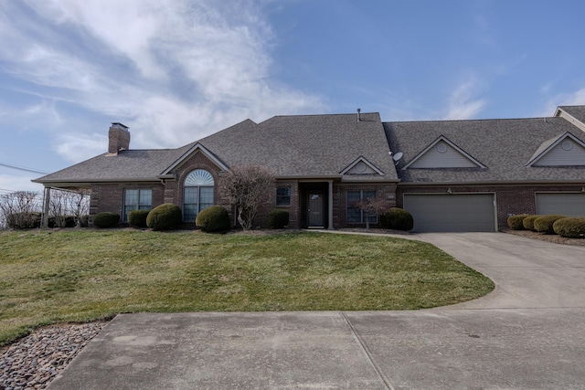 view of front of house featuring driveway, an attached garage, a chimney, a front lawn, and brick siding