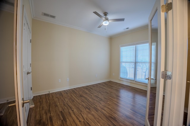 unfurnished bedroom with visible vents, ornamental molding, and wood finished floors