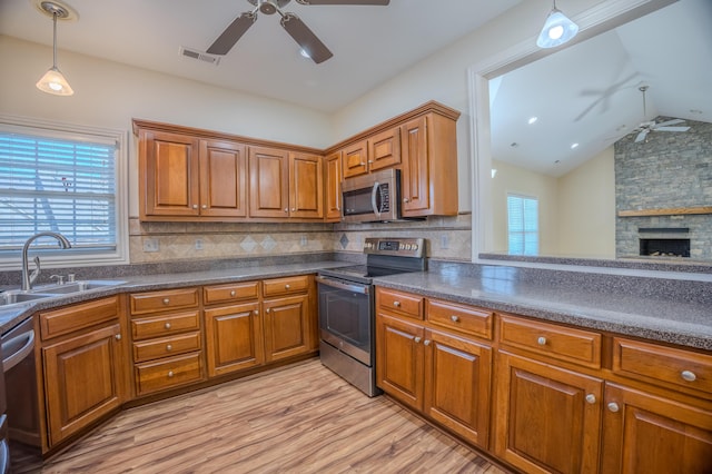 kitchen with visible vents, appliances with stainless steel finishes, a ceiling fan, and a sink