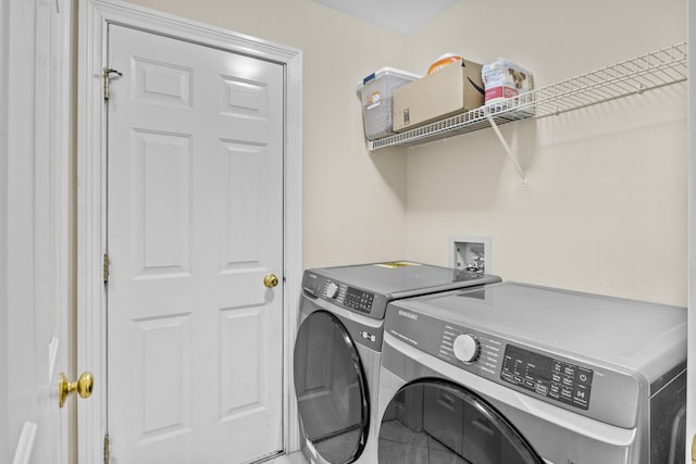 laundry area with washing machine and dryer, laundry area, and tile patterned flooring