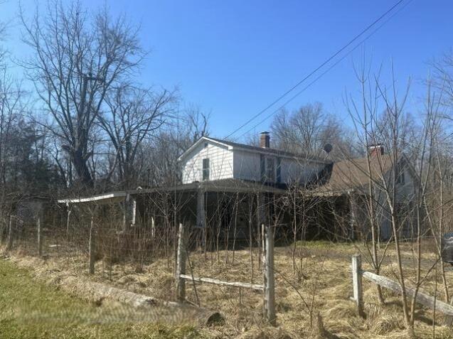 view of property exterior featuring a chimney