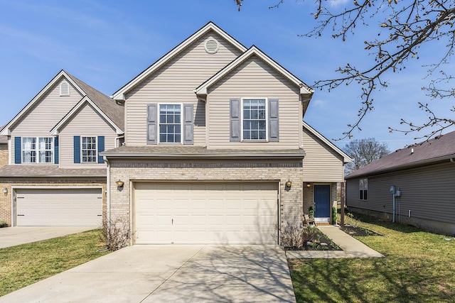 traditional-style home featuring brick siding, a front lawn, concrete driveway, and a garage