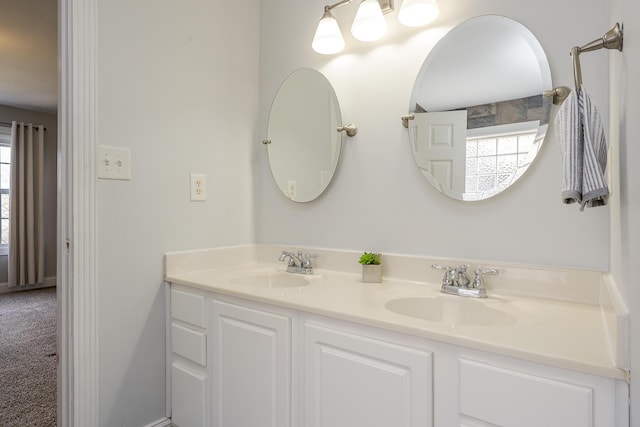 bathroom featuring double vanity and a sink