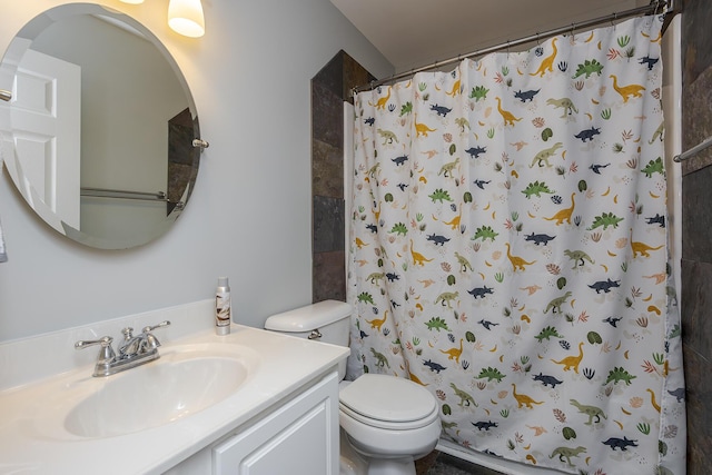 bathroom with vanity, toilet, and a shower with curtain