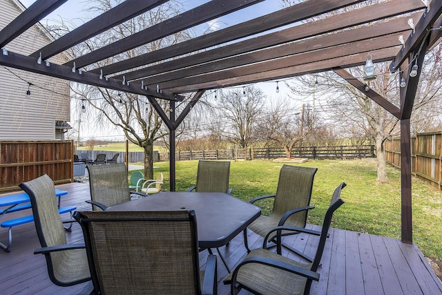 wooden terrace featuring a fenced backyard, outdoor dining space, a pergola, and a yard