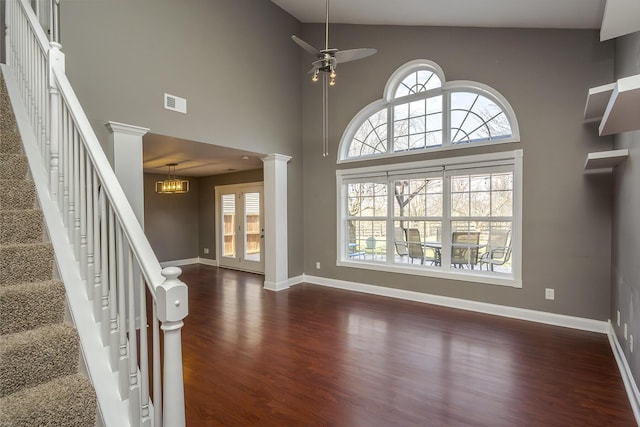 foyer with visible vents, baseboards, dark wood-style floors, and a ceiling fan