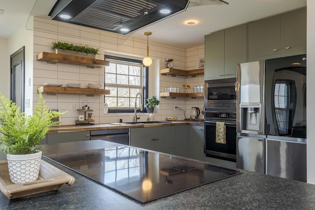 kitchen featuring range hood, open shelves, a sink, black appliances, and dark countertops